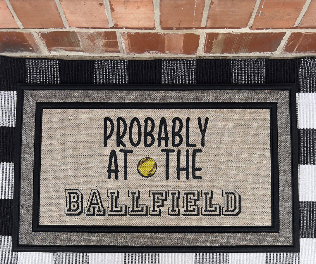 Probably at the ballfield - softball - doormat